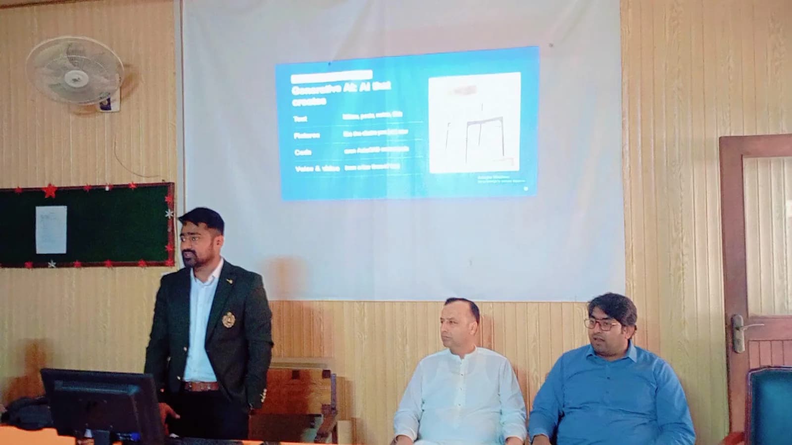 Qalab presenting at the front of the room at TEVTA Rawalpindi